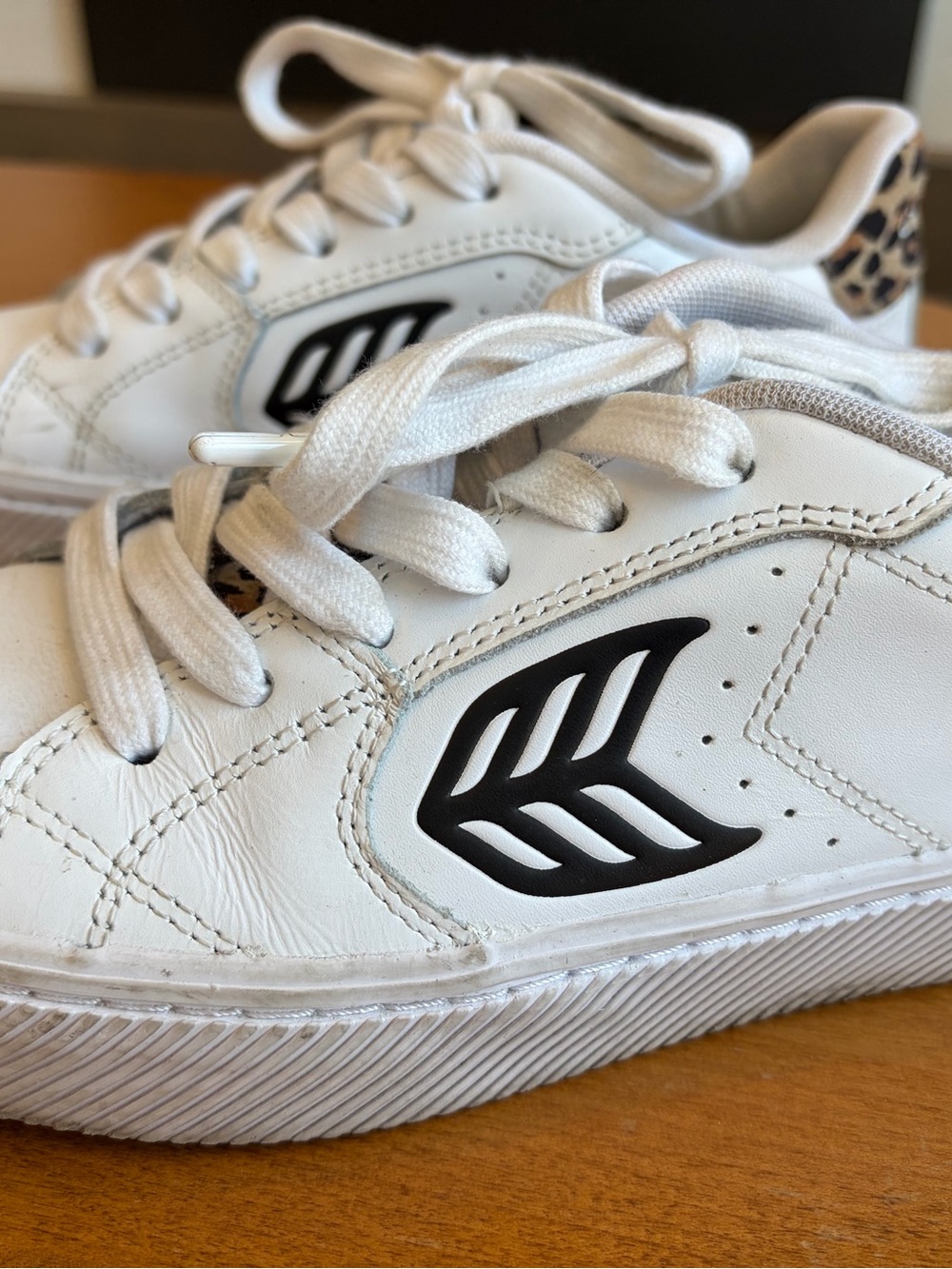 Womens Cariuma White Lace-Up Sneakers with Leopard accents